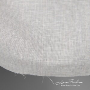 Wide linen fabric greyish white colour edge view