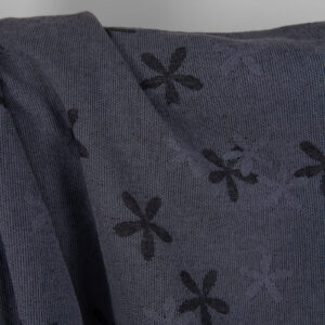 Washed linen cotton fabric with blueish grey flowers close up detail photo