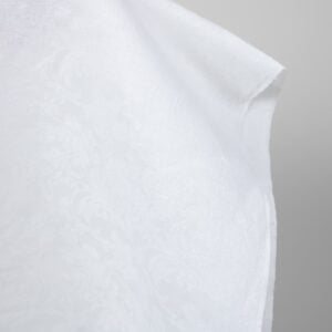 Optical white linen cotton fabric with flower ornaments edge