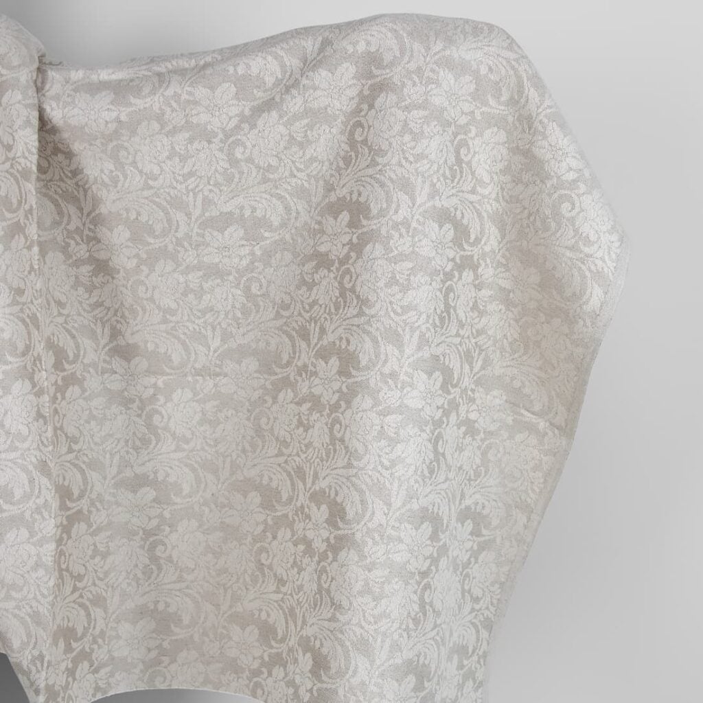 Undyed linen and white cotton fabric with flowers