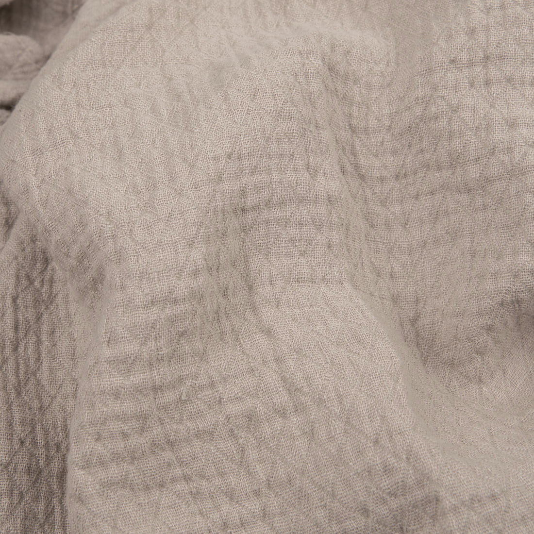 Light grey linen fabric with a diamond pattern washed