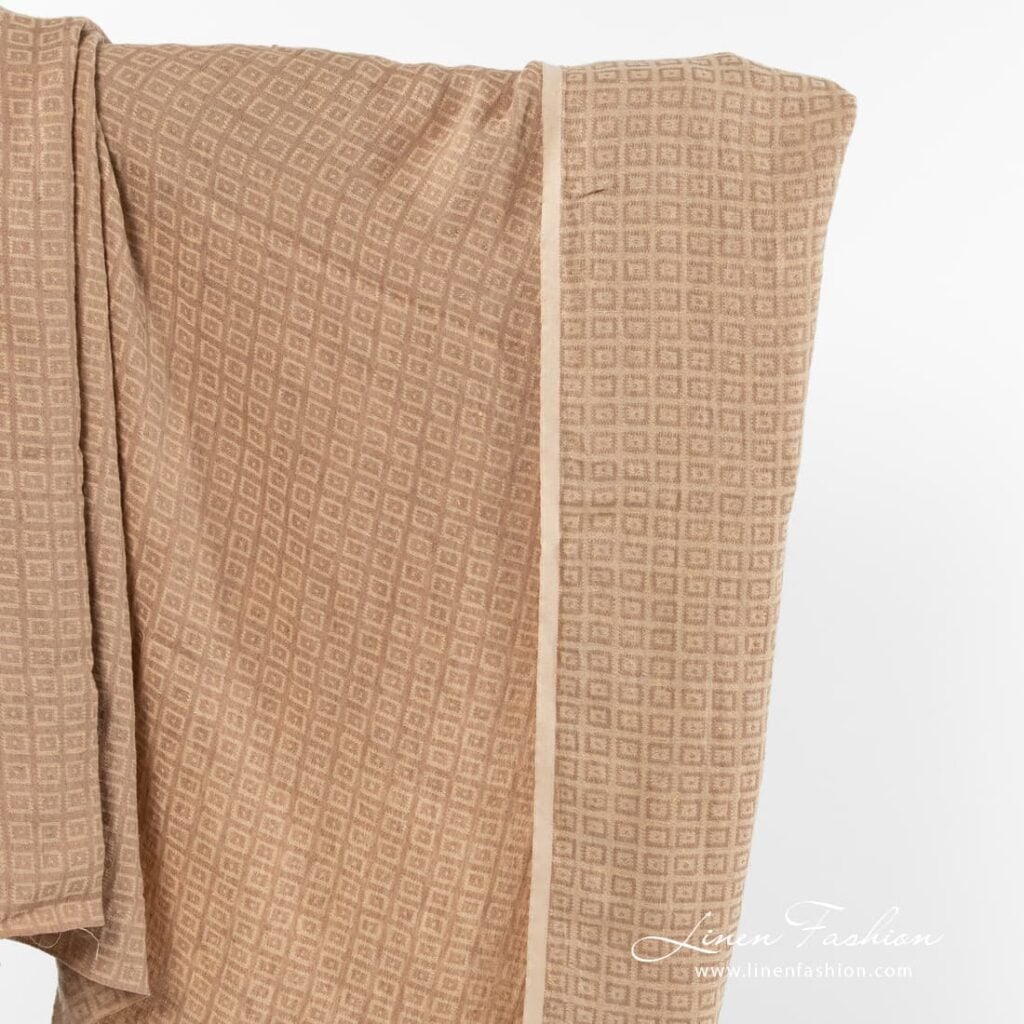 Double sided light brown jacquard linen fabric.