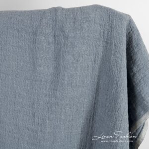 Bluish grey jacquard linen fabric in zigzag pattern, washed