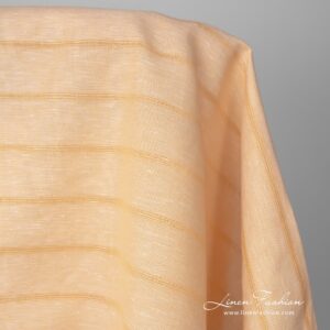 Gult lin-bomullsstoff i striper