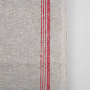 Narrow linen towel fabric in beige, with red stripes on one edge