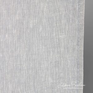Narrow linen fabric in white-grey melange close up photo