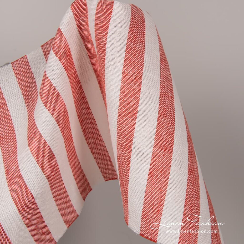 Linen fabric in off white and red stripes.