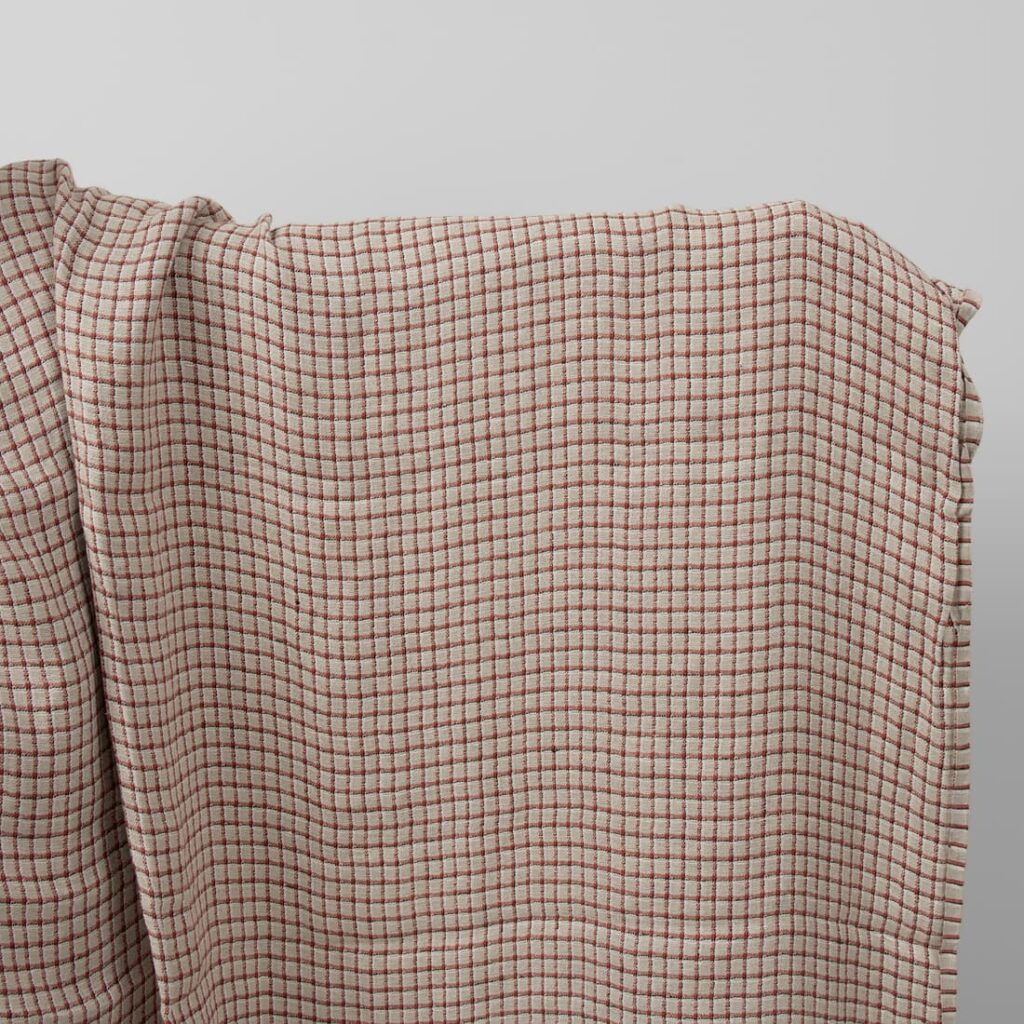 Linen grey fabric with red checks washed