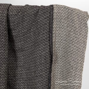 Linen fabric in small black grey diamond pattern.