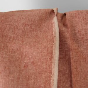Linen fabric brick red with beige melange, fabric edge
