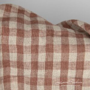 Washed linen fabric brown and natural checks close up detail