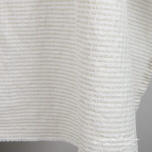 Light grey linen cotton fabric in checks, specially washed to increase softness