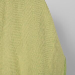 Washed linen cotton fabric yellow green herringbone, fabric edge