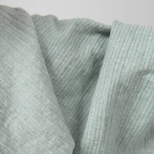 Washed linen cotton fabric greenish white colour striped close up detail