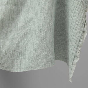 Washed linen cotton fabric greenish white colour striped close up edge