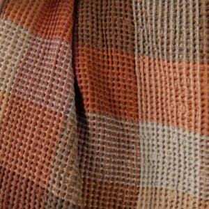 Washed linen cotton fabric brown colour checks waffle close up detail