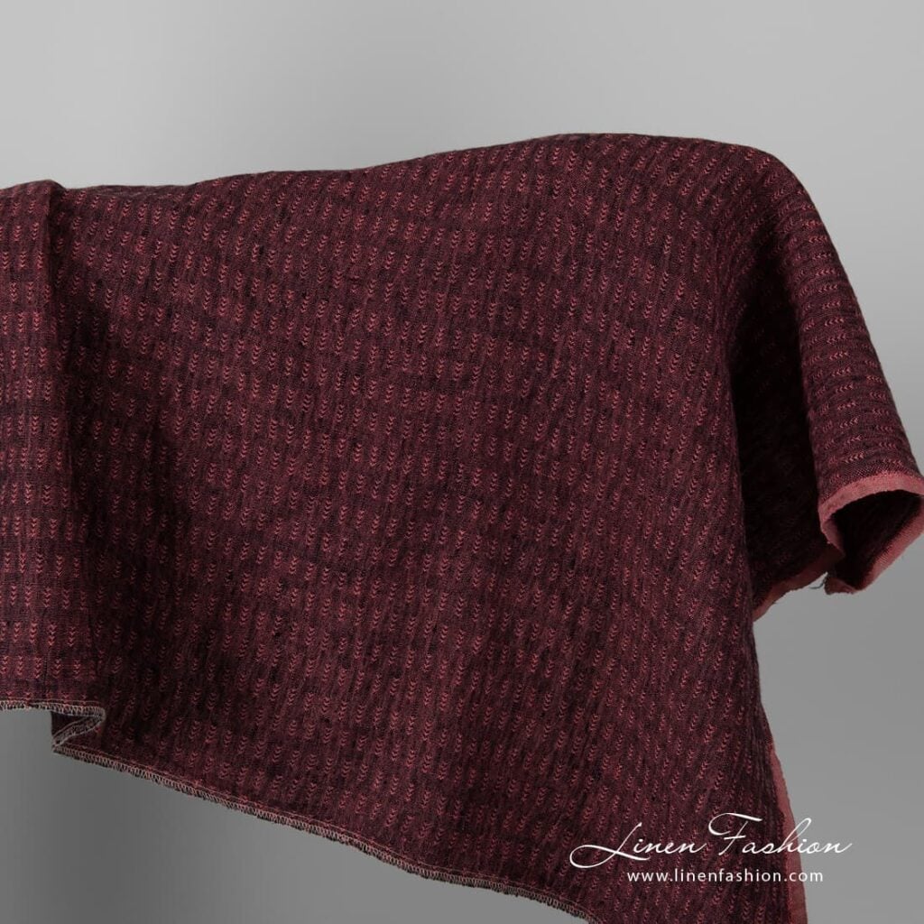 Black and rose colour patterned linen fabric.