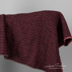 Black and rose colour patterned linen fabric.