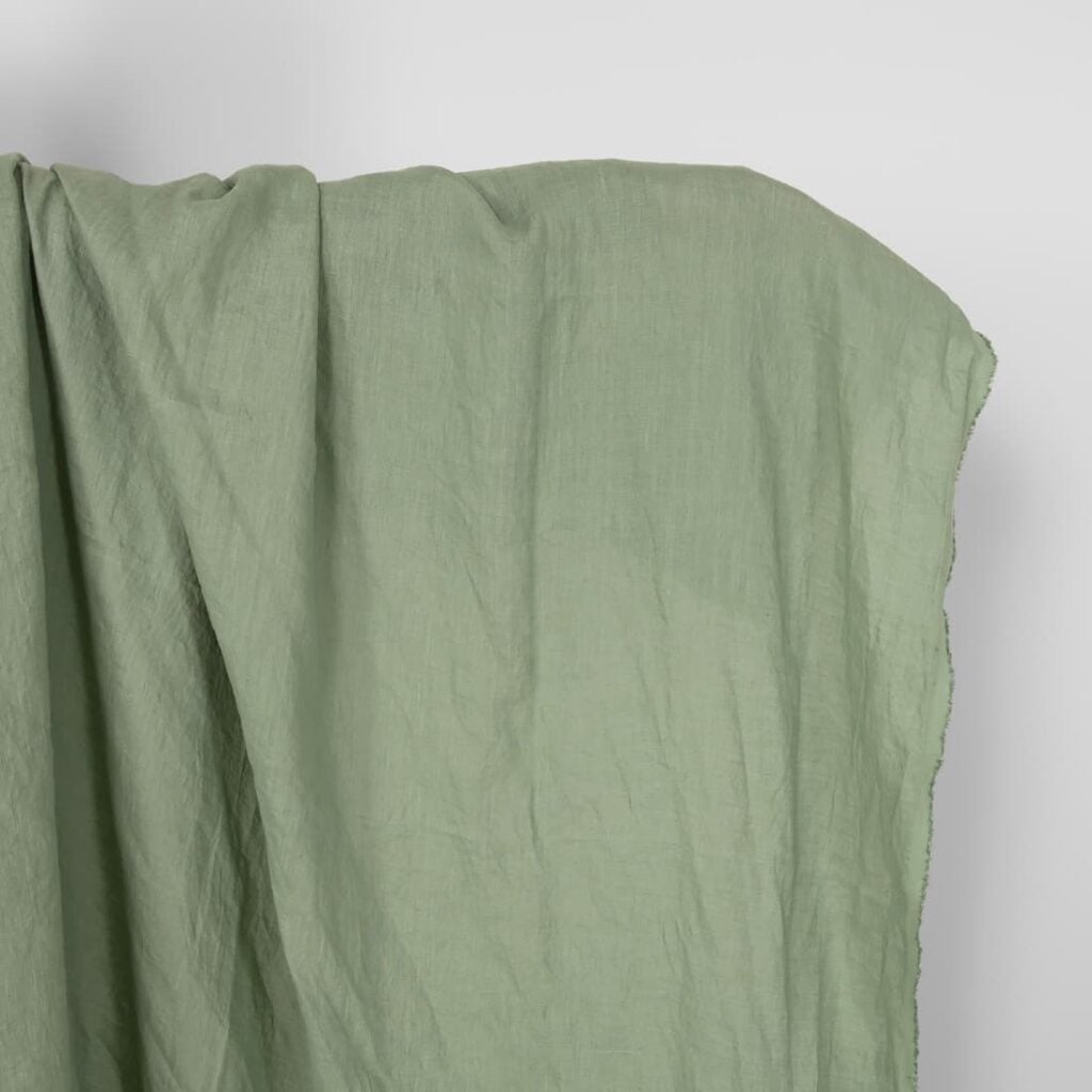 Washed linen fabric in muted light green