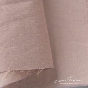 Linen cotton melange fabric has been woven from light yellow (cream colour) and light lilac (pink violet colour) yarns