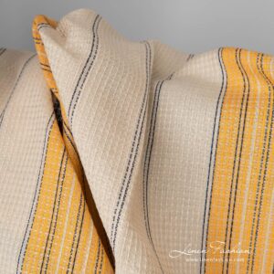 Linen cotton fabric sand waffle with yellow blue stripes close up detail