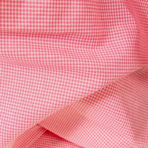 Linen cotton fabric in bright pink checks close up detail