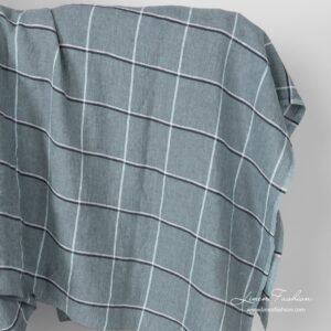 Washed green grid check linen fabric.