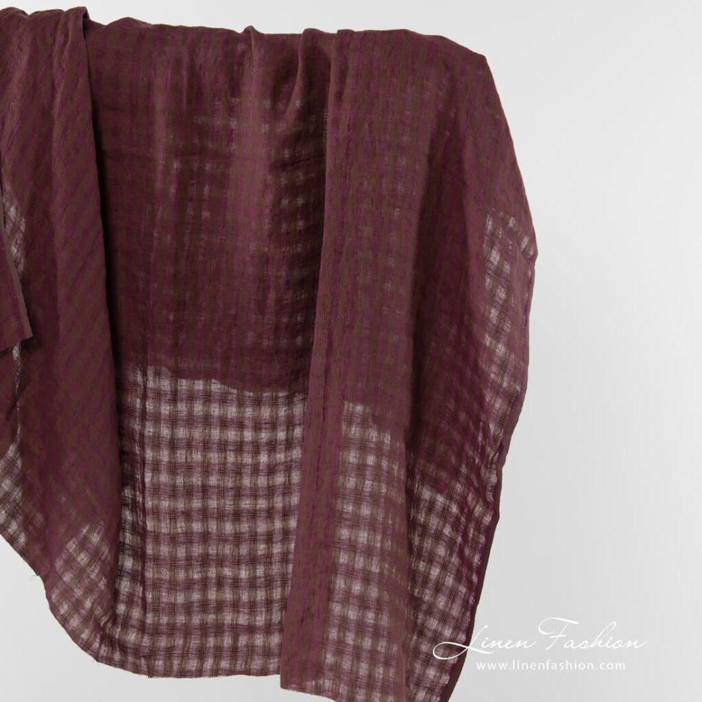Linen fabric in brown and purple checks.