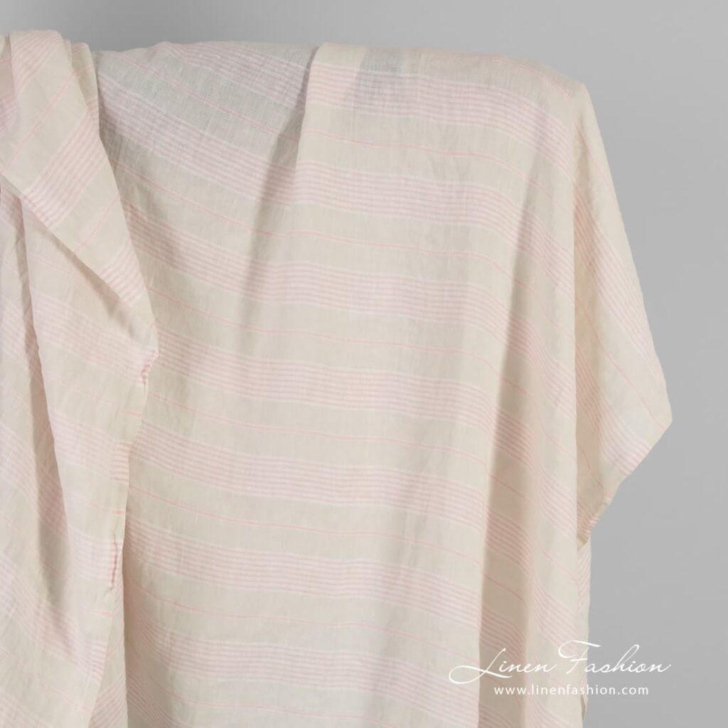 Yellow linen fabric in pink stripes