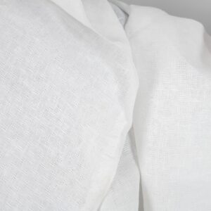 Off-white linen fabric in an openwork pattern texture