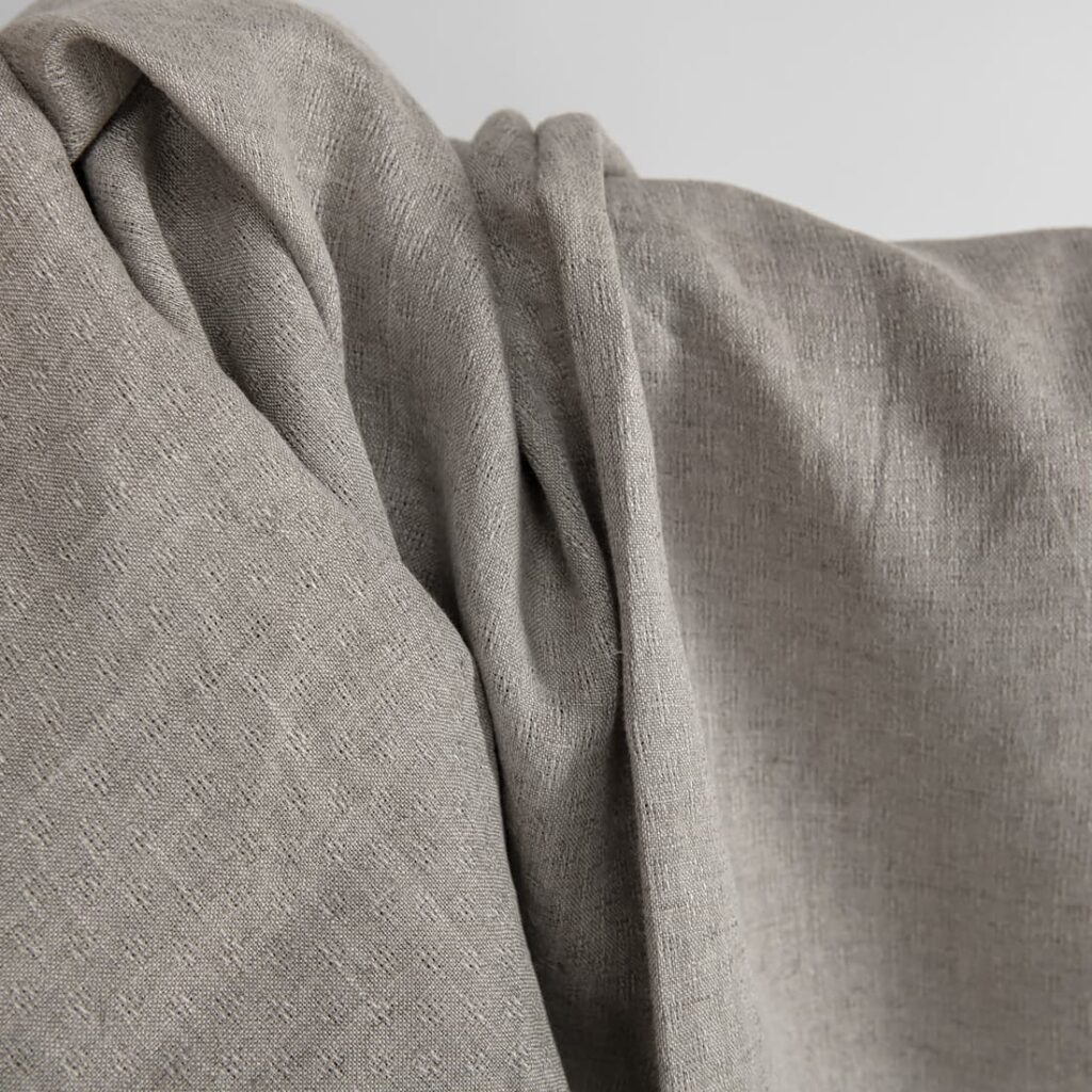 Naturlig linstoff i et åpent mønster 3 Natural linen fabric in an openwork pattern texture