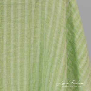 Washed 100% linen fabric in lime green stripes.