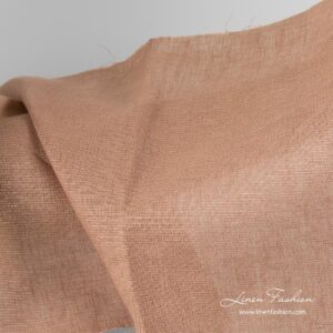 Brunt skinnende linstoff