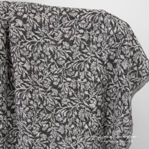 Black linen cotton jacquard fabric with flowery ornaments, washed