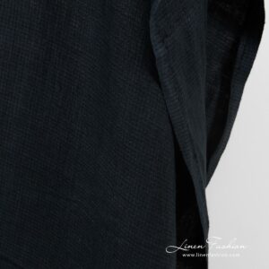 Dark blue linen fabric in twill weave and barely visible checks, specially washed