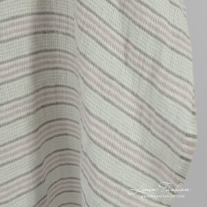 Green striped linen fabric in waffle pattern, specially washed to increase softness