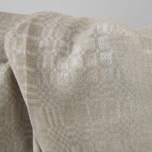 Beige linen fabric in checks dobby close up detail