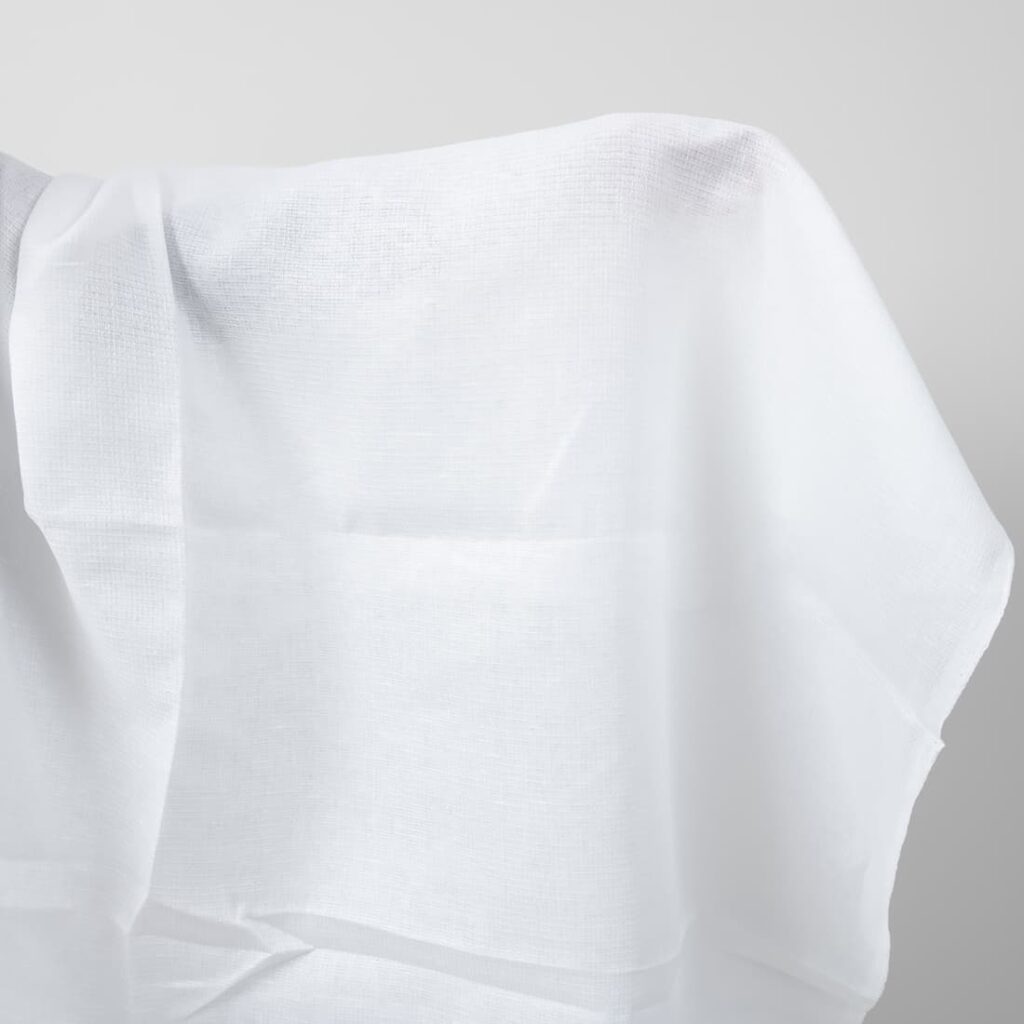 Bright white linen fabric in a small check pattern