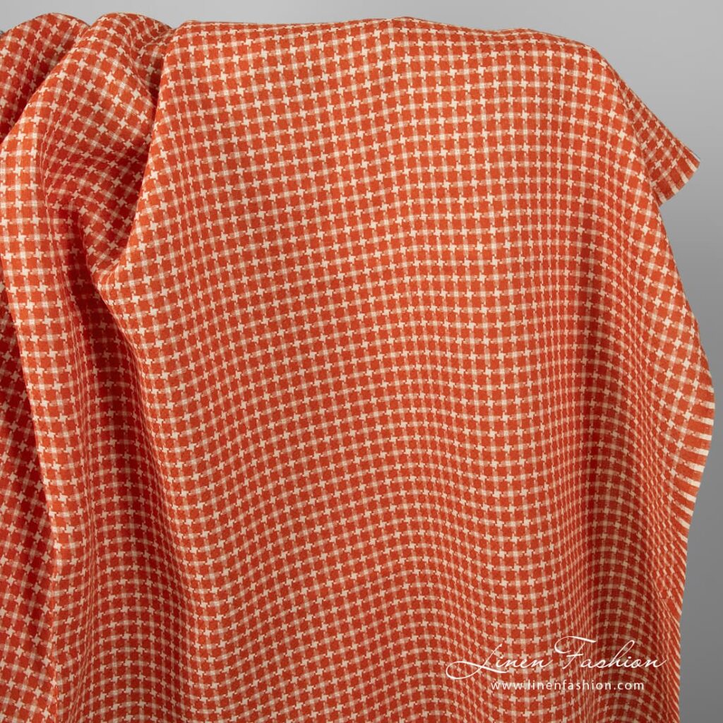 Red linen fabric in houndstooth pattern.