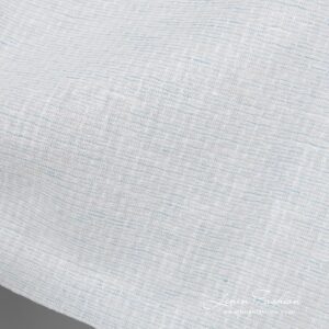 Linen cotton fabric blueish white pattern close up detail