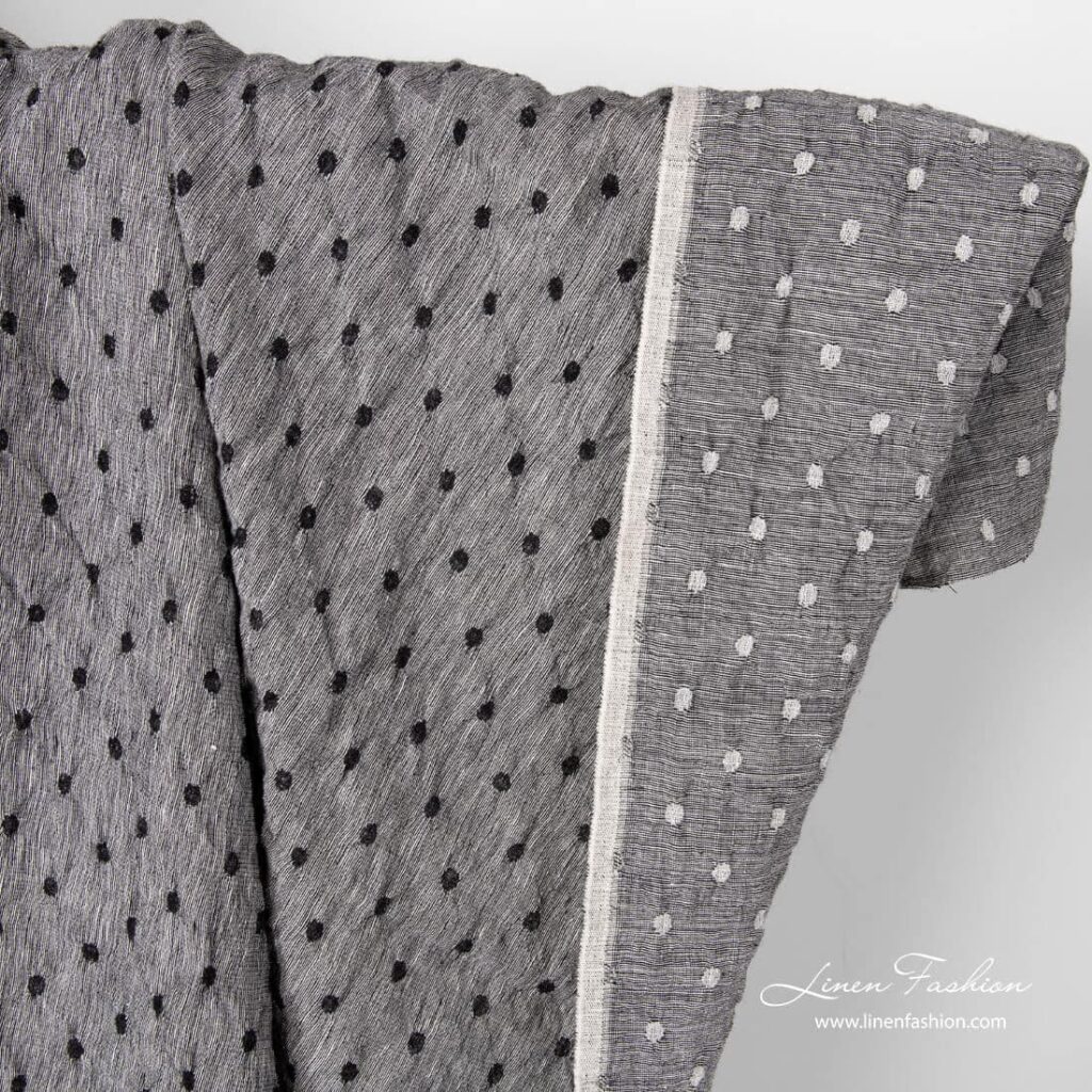 Black white linen wool fabric with dots.