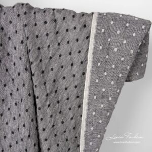 Svart/hvitt lin-ullstoff med prikker vasket 4 Black white linen wool fabric with dots.