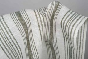 Hvitt stripet linhåndkle-stoff
