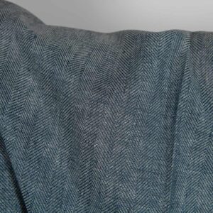 Linen wool fabric blueish-black and white herringbone close up detail