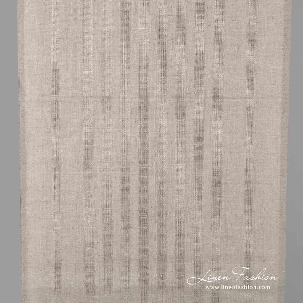 Linen fabric in natural flax colour with stripes.