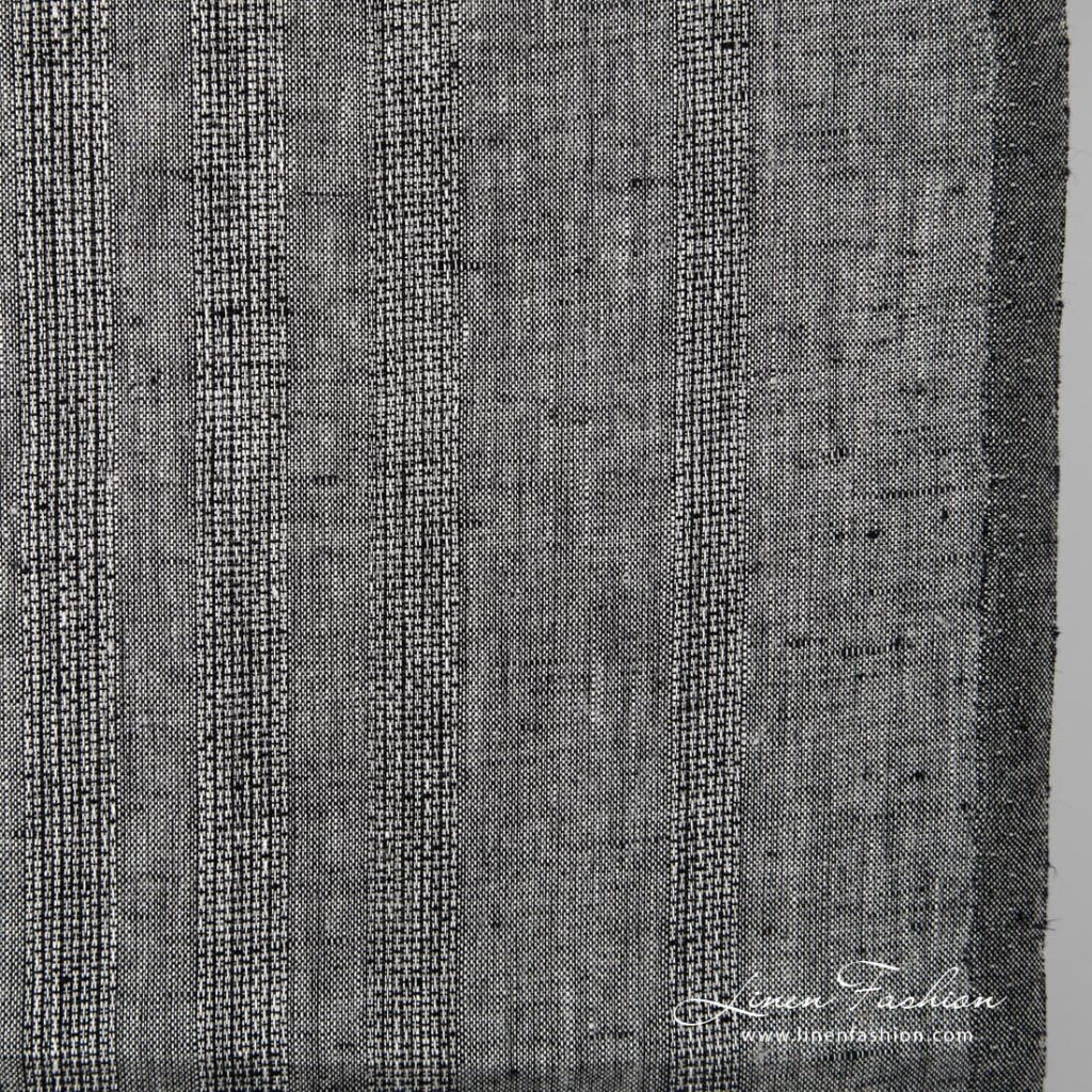 Svartgrått linstoff med gjennombrutte striper 2 Black grey linen fabric.