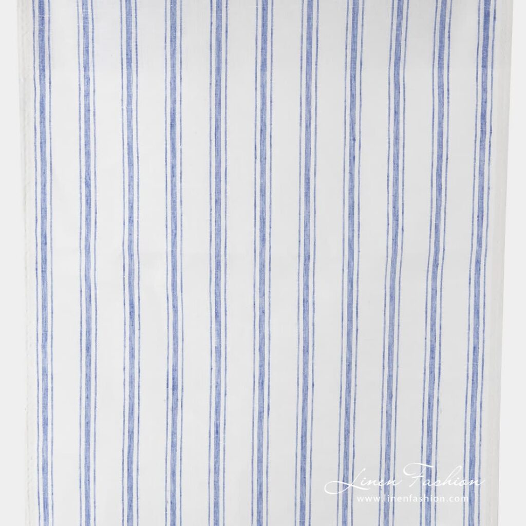 Off white narrow fabric with blue stripes.