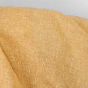 Linstoff lys gul og leire melert, vasket