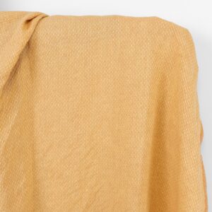 Linstoff lysgult og leirefarget prikkete, vasket