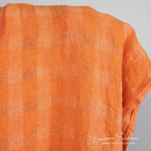 Orange linen fabric in transparent checks, specially washed to increase softness
